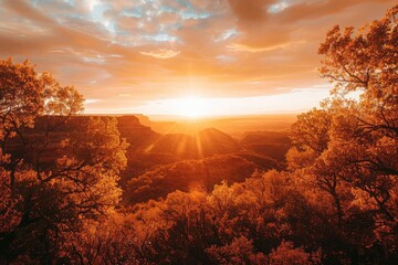 Wall Mural - Stunning autumn sunrise over a scenic mountain landscape with vibrant foliage and a golden sky, perfect for nature and travel inspiration.