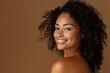 © LukaszDesign - Curly hair, black woman, natural skincare, beauty, makeup, radiant skin, face cosmetics, aesthetic health, studio background. Afro and body care portrait of cheerful young African model.