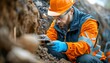© ZeNDaY - Precision in Construction: Worker Using Handheld GPS for Excavation Site Mapping