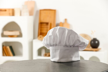 Canvas Print - White kitchen interior and white cook hat. Empty space for your decoration. 