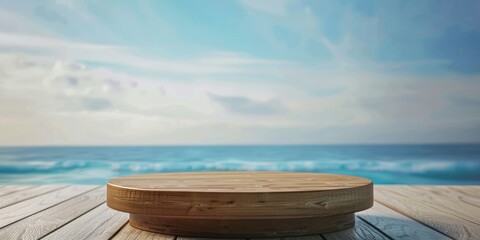 Empty wooden podium on the beach with blue sky and ocean background.