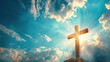 © AstraNova - holy sunlight shining on the Christ wooden cross symbol with religious clouds on blue sky background