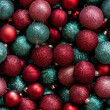 © Sawoon - Closeup seamless pattern tile pile glass bauble ornament shiny metallic glitter dark red green silver vintage Christmas decor texture background repeat classic joy pretty lux colorful balls flatlay
