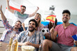 © NDABCREATIVITY - Group of multi-ethnic people celebrating football game