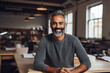 © lermont51 - Middle aged Indian Man Smiling Happily in a Cozy Office Environment