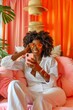 © CYBERUSS - Stylish Woman Relaxing on Sofa with Smartphone in Vibrant Living Room