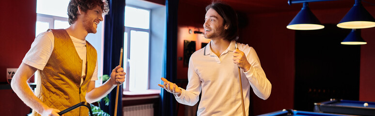 Wall Mural - Friends laugh and chat while enjoying a casual game of billiards.