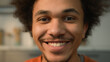 © Yuliia - Close up portrait African American ethnic guy male man looking away to side look at camera face healthy happy smiling toothy dental teeth white skincare medicine facial laugh smile fun joy at home