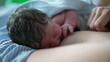 © Marco - Closeup of newborn breastfeeding for the first time after childbirth, bonding time with mother during first minutes of life