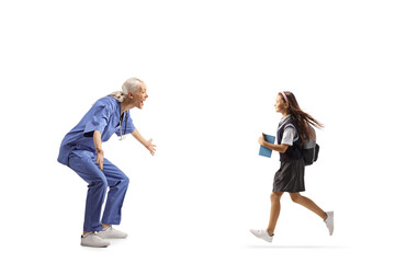 Poster - Profile shot of a happy female health care worker waiting to hug a schoolgirl