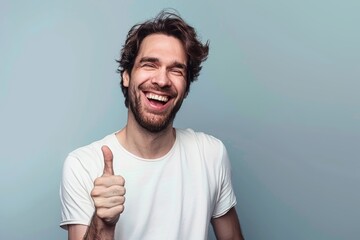 Wall Mural - Portrait of a grinning man in his 40s showing a thumb up isolated on pastel gray background