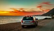 © Bilal - sunset on the beach, car at sunset, wallpaper summer road trip background, car parked on the beach with beautiful vibrant red sunset sky, travel vacation concept
