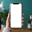 © C.Castilla - Estilo de vida y tecnología. Smartphone con pantalla en blanco para maqueta de diseño. mano que sostiene un smartphone con la pantalla en blanco en el salón de su casa.