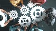 © Summit Art Creations - Top view of professional business people joining and gathering wooden gear together. Aerial view of diverse team working together to put or collect cog with network connection holographic. Symposium.