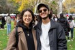 © volga - Smiling young adult friends enjoying an outdoor event