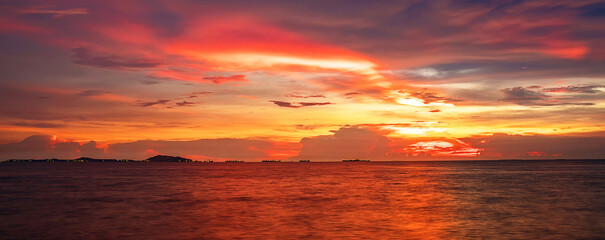 Wall Mural - Twilight sky background. Colorful Sunset sky and cloud.vivid sky in twilight time background.Fiery orange sunset sky. Beautiful