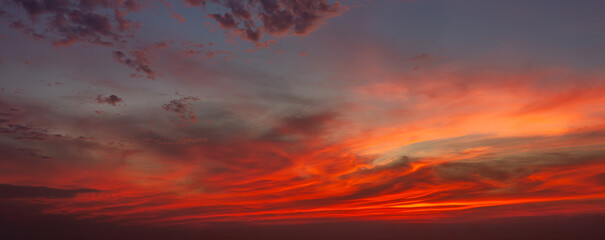 Wall Mural - Twilight sky background. Colorful Sunset sky and cloud.vivid sky in twilight time background.Fiery orange sunset sky. Beautiful