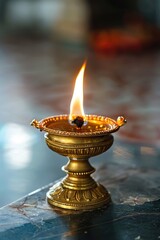 Aufkleber - A single lit candle sits on a wooden table with a simple background