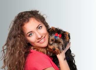 Canvas Print - Young woman holds and hugs cute dog