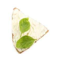Wall Mural - Piece of bread with cream cheese and basil leaves isolated on white, top view