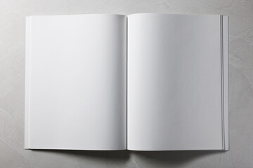 Wall Mural - Open notebook with blank pages on grey textured background, top view. Mockup for design