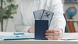 © kinomaster - Travel agent holds out a passport with airline tickets