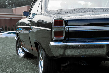 Close up view of black vintage car tail lamp.