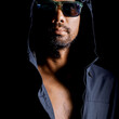 © STOCK PHOTO 4 U - Mysterious Man in Hooded Jacket and Sunglasses Against Black Background