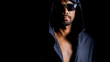 © STOCK PHOTO 4 U - Mysterious Man in Dark Hooded Jacket and Sunglasses Against Black Background