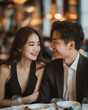 © Jirut - An Asian couple threating themselves in a French style restaurant