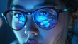 © Irina Ukrainets - Woman in glasses with blue digital reflections working on computer technology. Conceptual image demonstrating focus on data analytics and information technology. AI