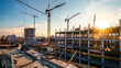 © Artistic Visions - construction site for a large building with a clear blue sky background