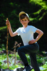 Sticker - Child hiker with stick standing on stone