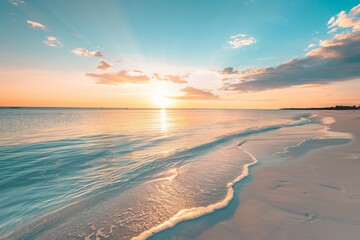 Poster - Tranquil tropical beach at sunset with golden light reflecting on the water