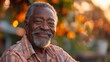 © svastix - An elderly man with gray hair and a warm smile is captured with the golden hour light illuminating his face