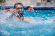 © Viga - Portrait for male enjoy water ars and having hard splash of water on his face looking for revenge while smiling and having fantastic moments