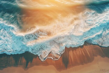 Wall Mural - Sunset aerial view of waves crashing on sandy beach