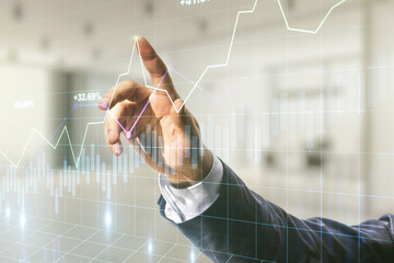 Poster - Multi exposure of man hand with pen working with abstract virtual financial graph on blurred office background, forex and investment concept