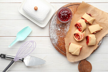 Wall Mural - Composition with raw buns, jam and utensils on light wooden background