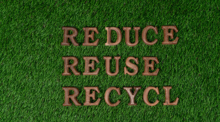 Environmental awareness campaign showcase arranged recycle message in on biophilic green grass background. Environmental social governance concept idea for sustainable and greener future. Gyre