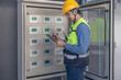 © SpaceOak - HVAC Technician Checking and Inspecting Control Panel