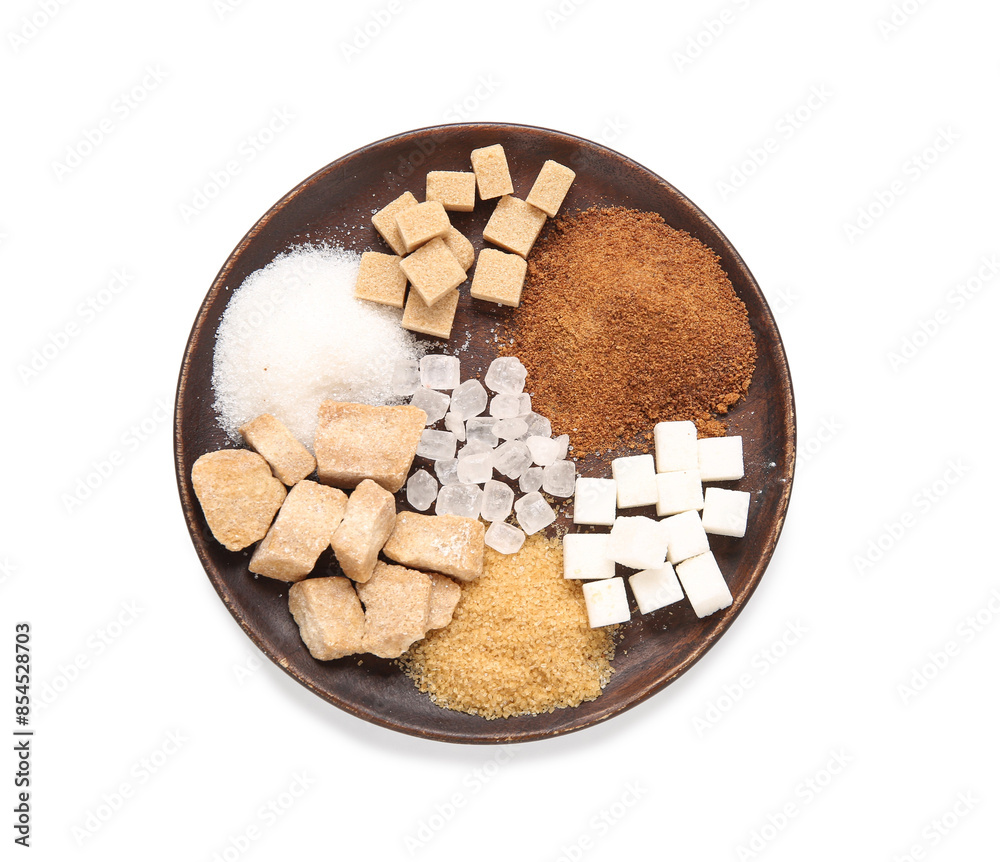 Plate with different types of sugar on white background