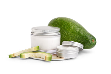 Wall Mural - Jars of cosmetic products and fresh avocado on white background