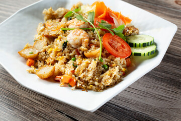 A view of a plate of seafood fried rice.