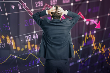 Poster - Back view of stressed young european businessman looking at glowing falling forex chart and index grid on blurry background. Crisis and financial recession concept. Double exposure.