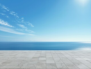 A vast, calm ocean stretches under a clear blue sky, viewed from a marble-tiled terrace.