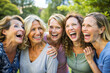 © Creative Catalog - Group of Mature Women Laughing Together Outdoors, Friendship Day