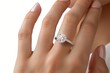 © reels - Elegant close-up of a woman's hand showcasing a stunning diamond engagement ring, perfect for bridal and jewelry themes.