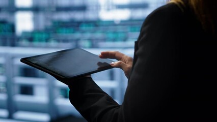 Poster - system administrator monitoring server room, doing checkup, inputting data on tablet of needed fixes