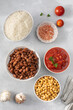 © Виктория Попова - Ingredients for healthy vegan dish cooking on grey table